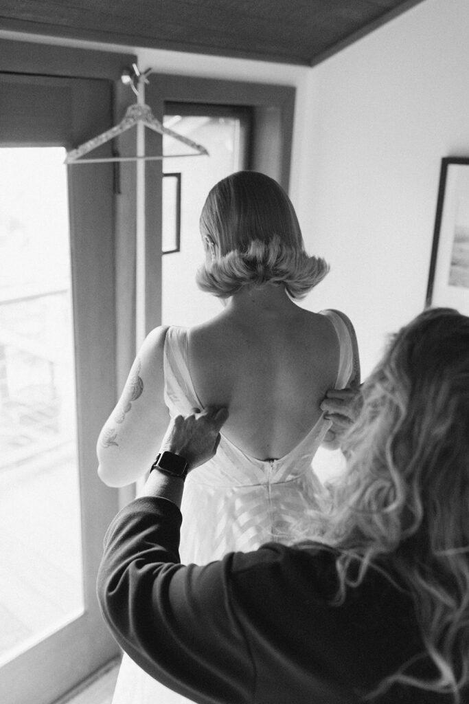 A black and white image of a bride getting ready before her Vashon Island wedding in Washington state 