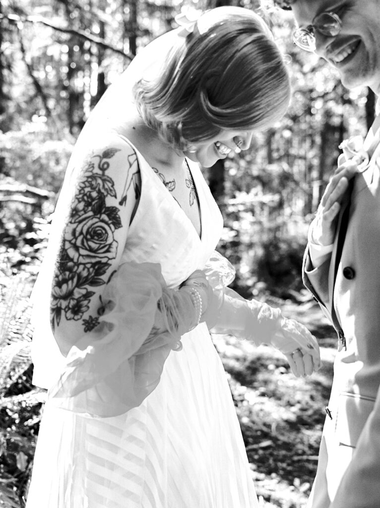 A b+w photo of a candid moment between Washington newlyweds at their Vashon Island wedding 
