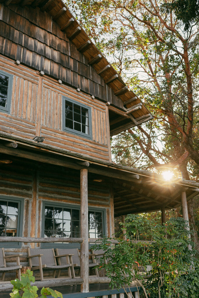 The sun shines through the trees next to on-site lodging at Captain Whidbey Inn, a Whidbey Island wedding venue
