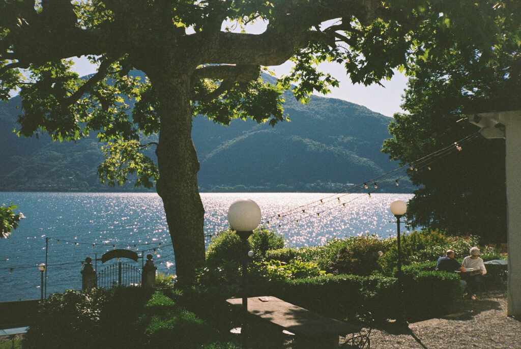 The view of the water from villa la felice is shown in an image taken at a destination wedding on Lake Como