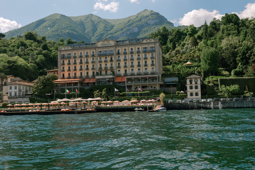 An Italian waterfront village is photographed from the water in a photo taken by destination wedding photographer, Mossfloor Photography