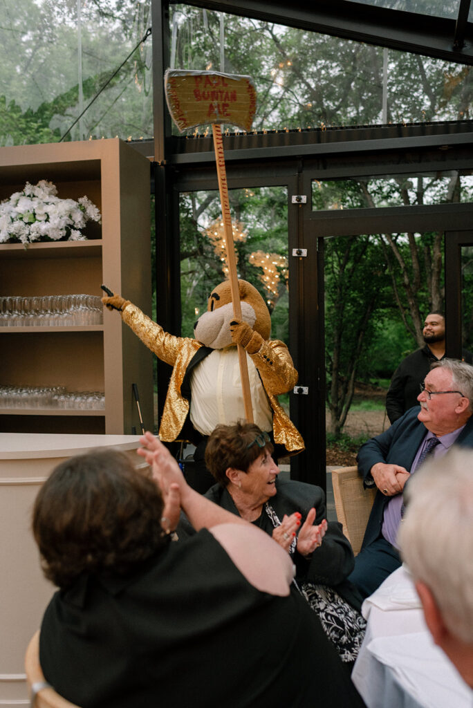 A college mascot entertains guests at a Bavaria Downs wedding at Woodland Glasshaus 