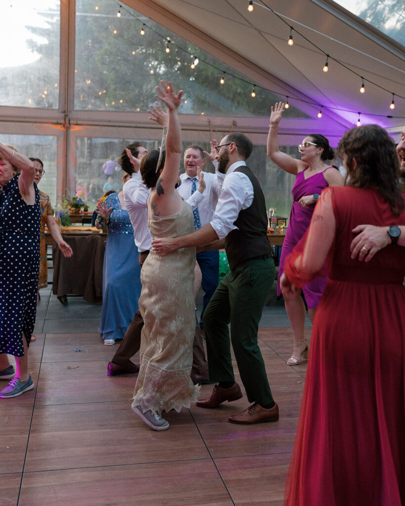 A bride and groom dance together at their hood river wedding reception at the griffin house