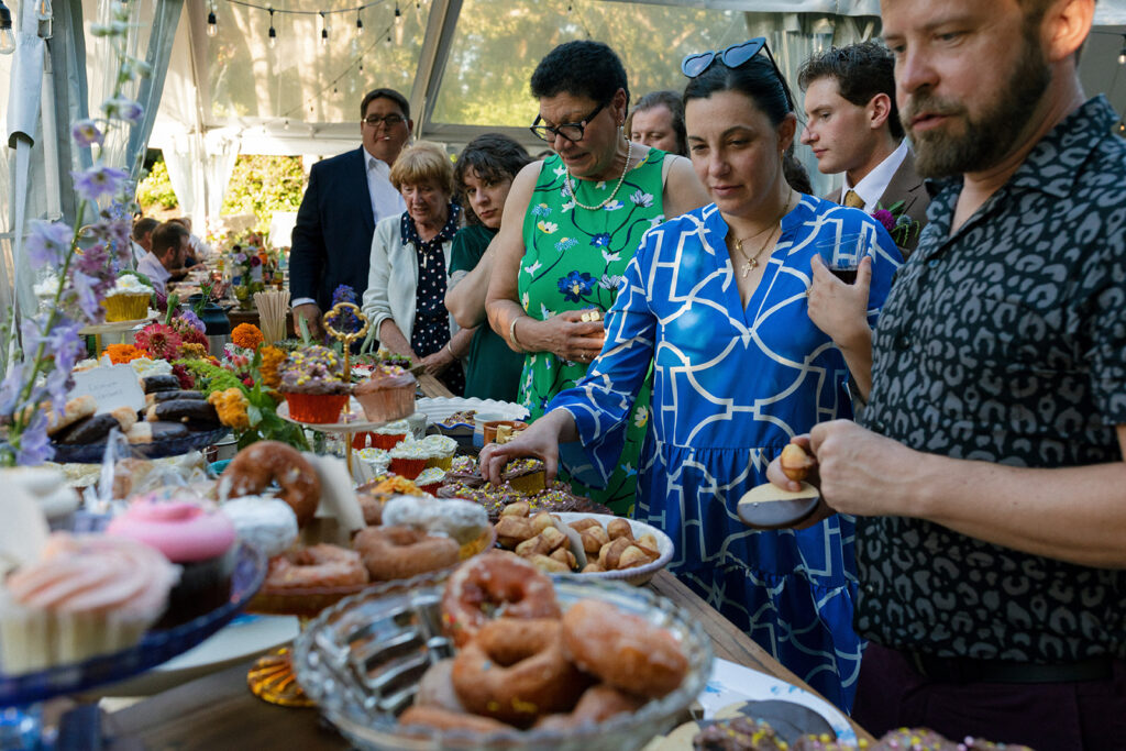 Wedding guests make their way through the food line at a wedding reception held at the griffin house hood river