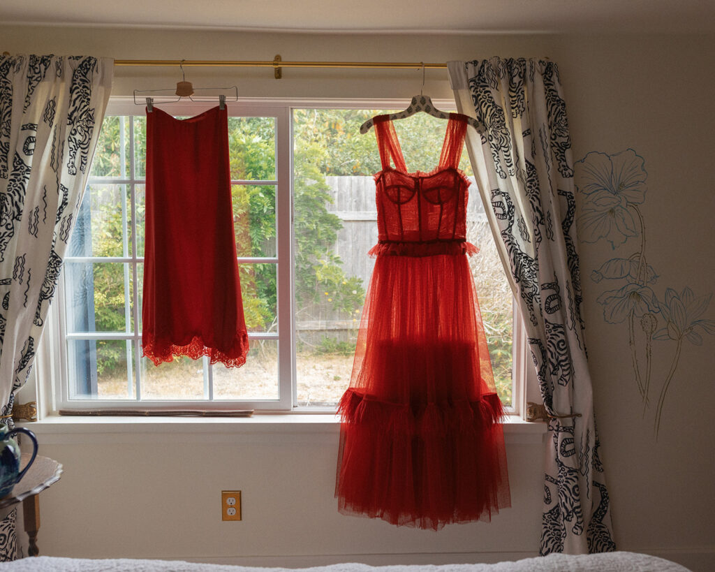 A red wedding dress hangs in the window of THe Tokeland Hotel and Restaurant in Tokeland WA
