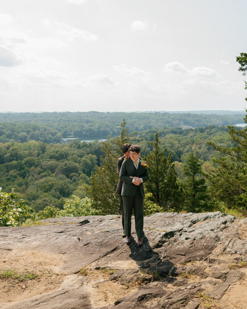 A cinematic wedding portrait showcases newlyweds with scenic views at their mountain lakes park north salem ny wedding