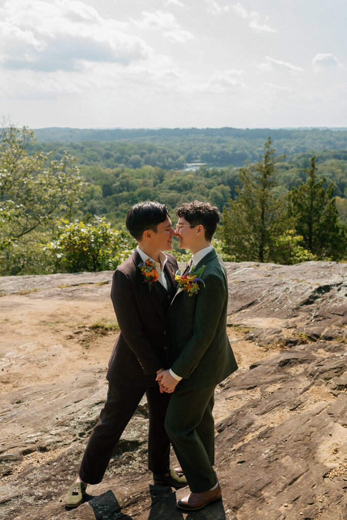 Newlywed partners embrace for couples portraits at Sal J. Prezioso Mountain Lakes Park, the location of their Westchester County wedding