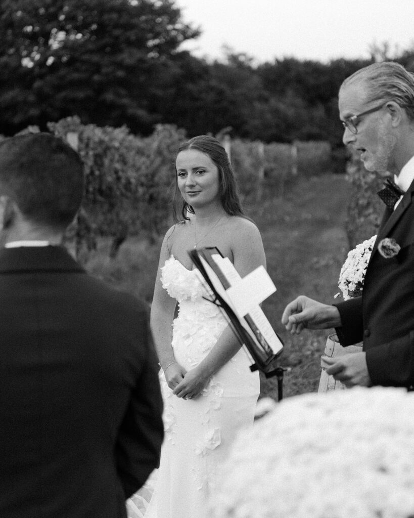 a bride is photographed in b+w at a new england vineyard wedding