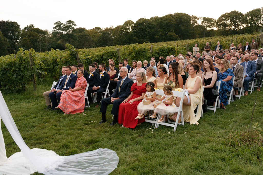 Guests are seated at a new england vineyard wedding