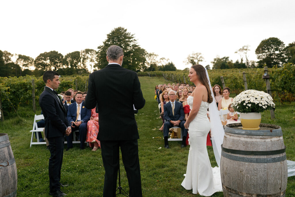 a bride and groom are photographed at greenvale vineyards ri