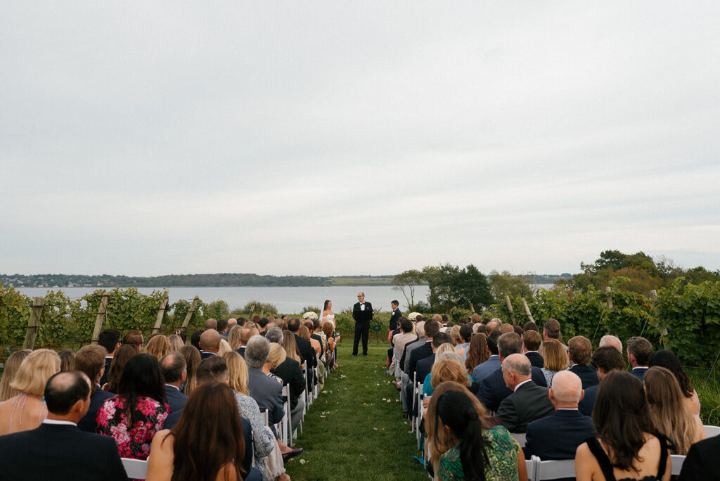 A ceremony is photographed at a Greenvale Vineyards wedding in RI