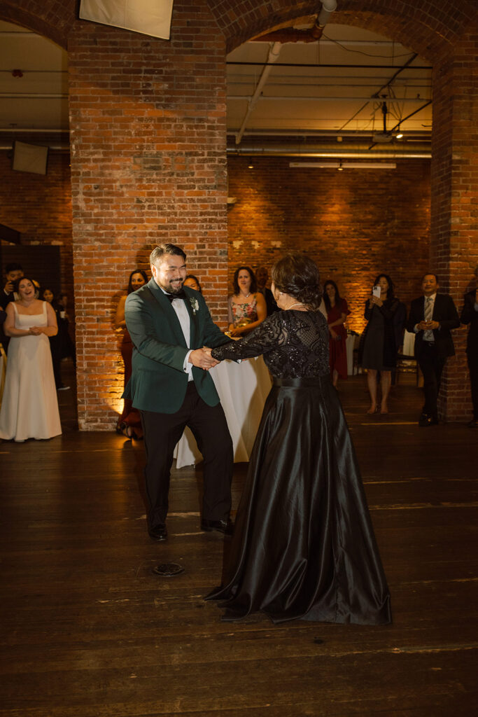 A groom & his mother share a dance at his Seattle Wedding reception at Axis Pioneer Square Seattle WA