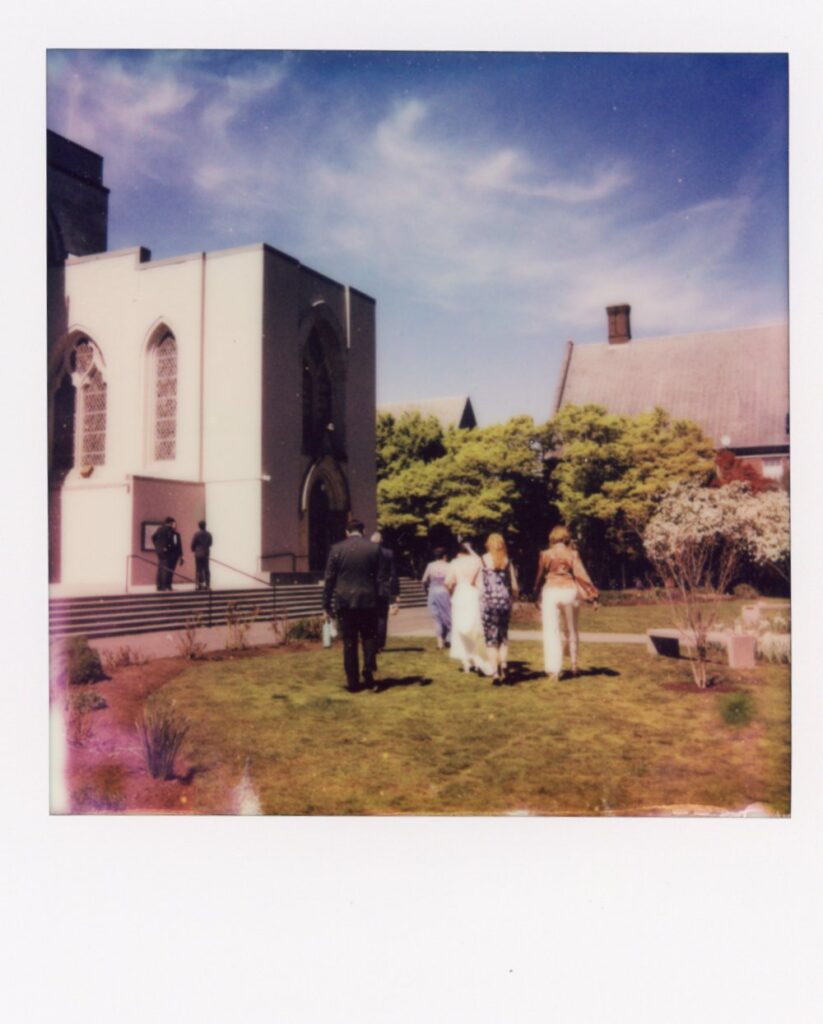 A polaroid depicts guests entering a Seattle wedding at St. Mark's Episcopal 