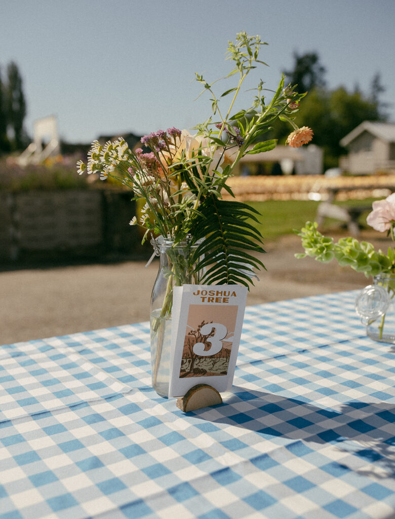 Summer camp themed table decor is photographed at a wedding in Edison WA 